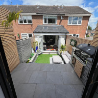 View from a garden room into a house extension