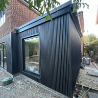 House extension with black cladding
